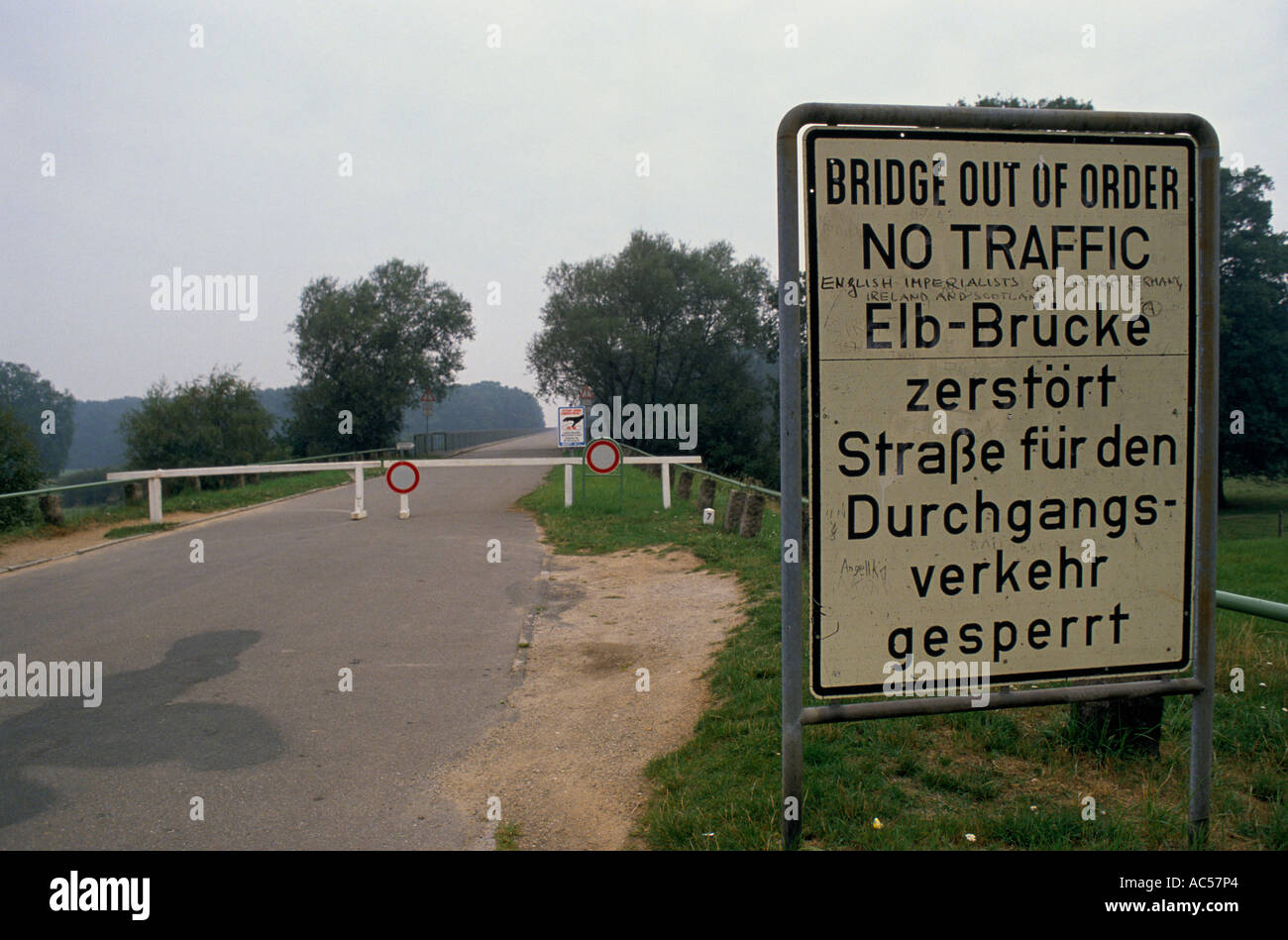 Road sign warns drivers of broken bridge Stock Photo