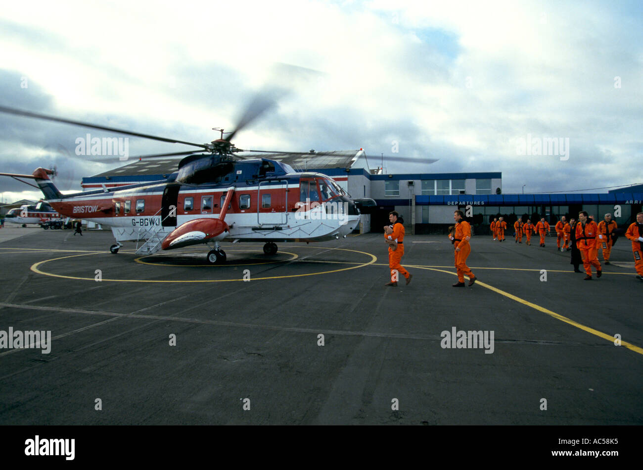 helicopter lands on Texaco;s Tartan Oil Rig in the north sea Stock Photo