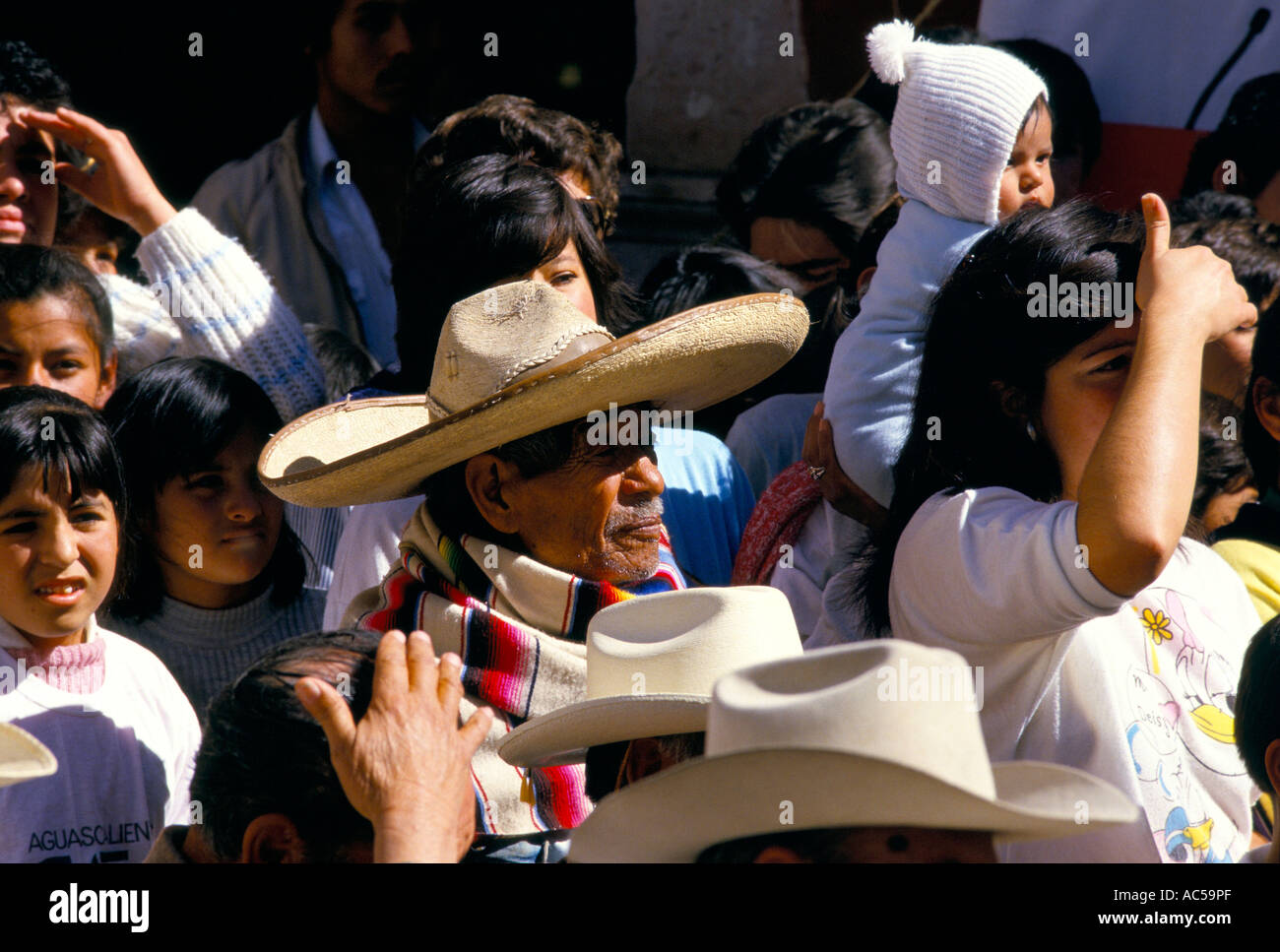 ELDERLY MAN IN THE CROWD WEARING A TRADITIONAL MEXICAN HAT Stock Photo