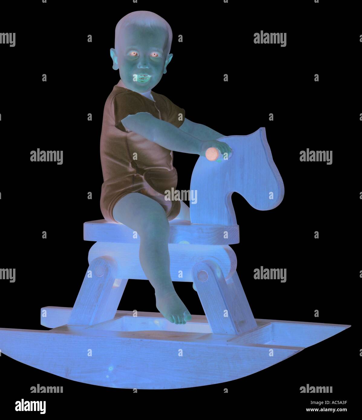 child on rocking horse