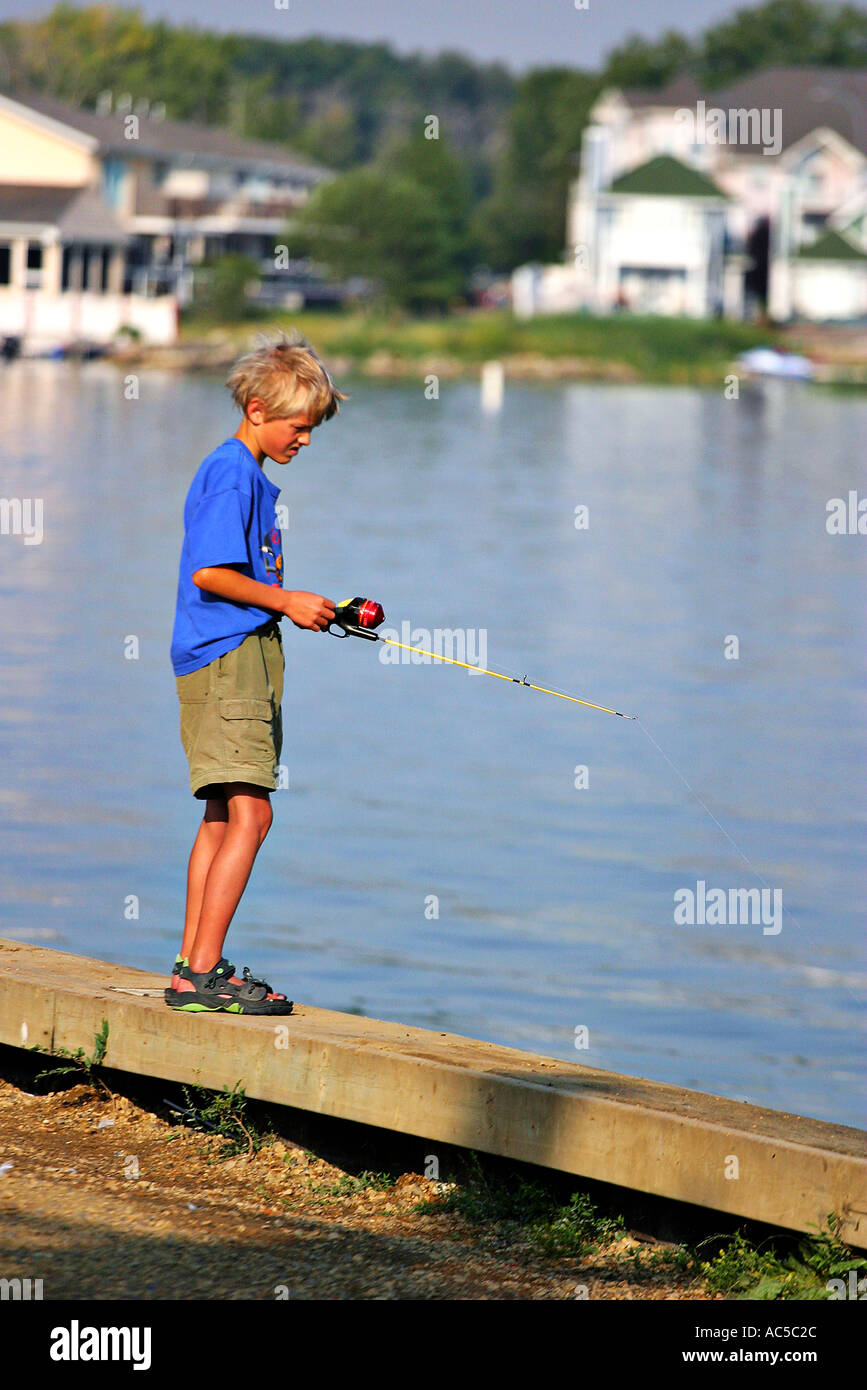 Boy Fishing on Sylvan Lake Alberta Canada Stock Photo