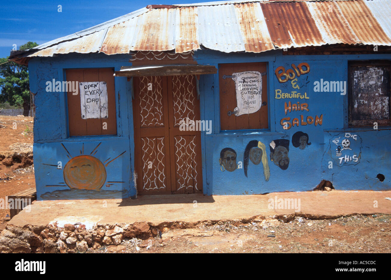 Hairdresser colourful tin shack south coast Jamaica West Indies Stock Photo