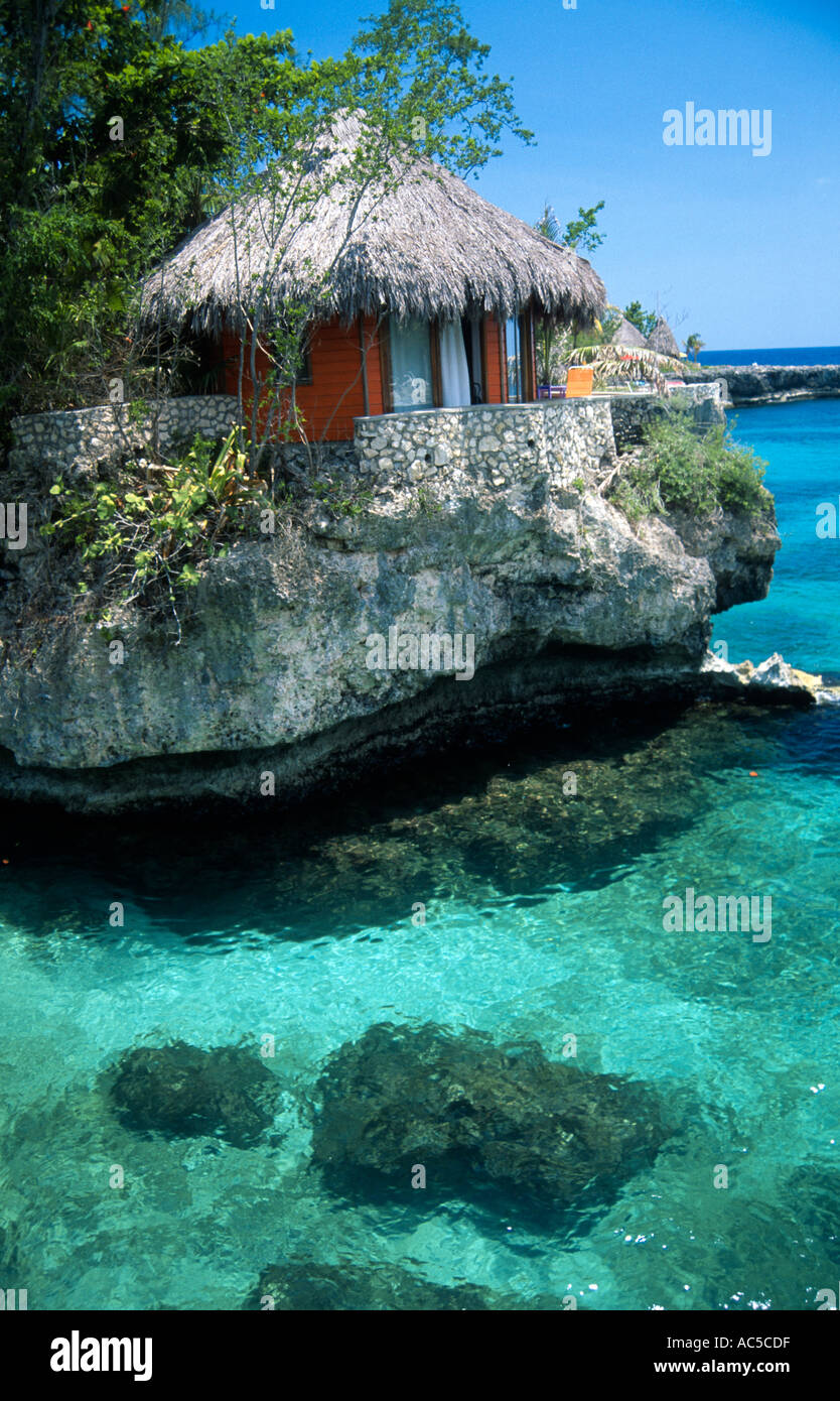 Ecotourism thatched roof guest rooms on the edge of cliffs and the sea