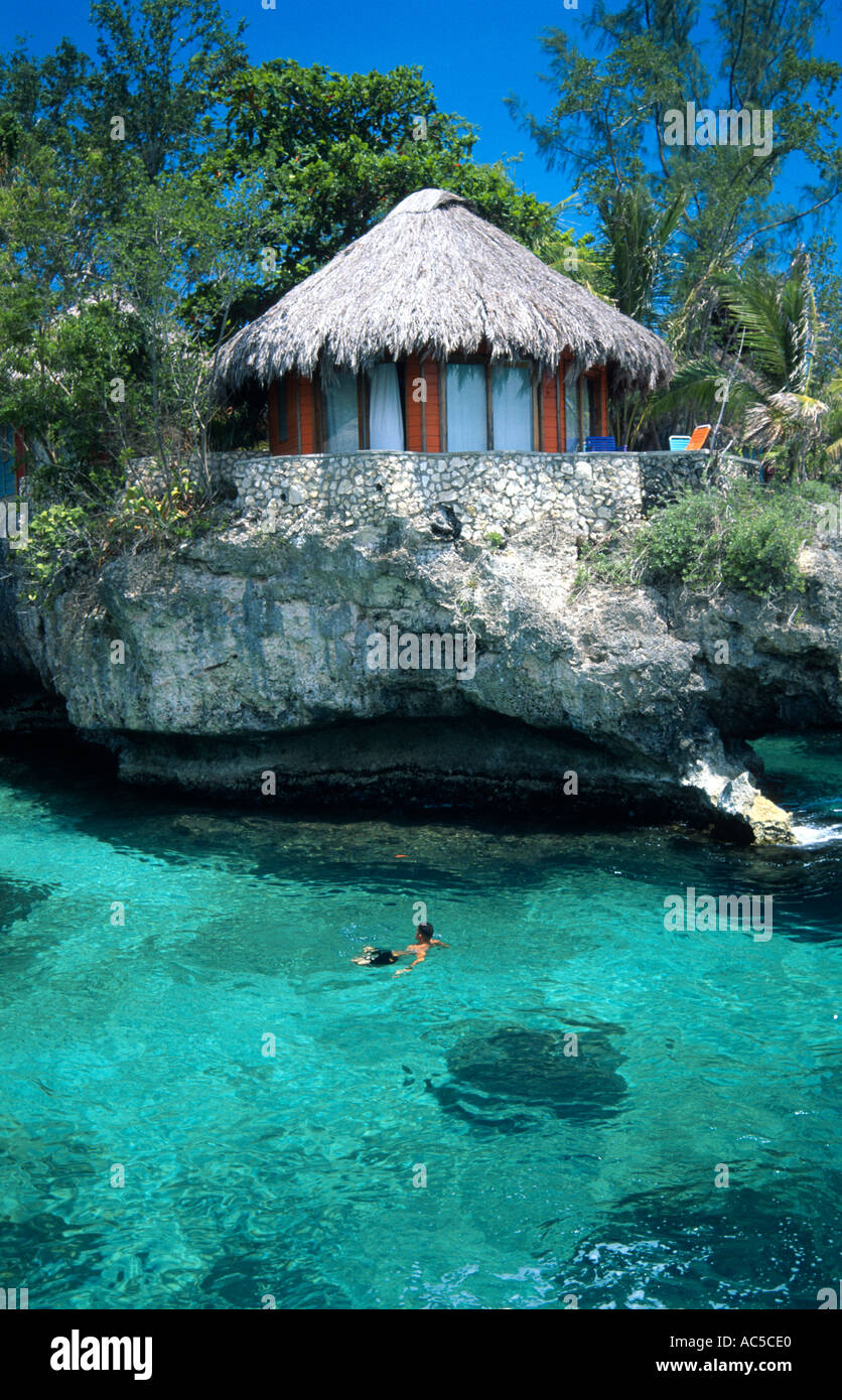 Ecotourism thatched roof guest rooms on the edge of cliffs and the sea