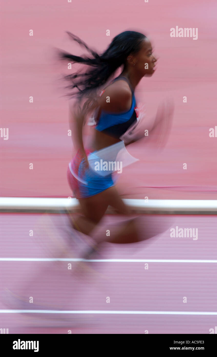 female competitor in a relay race Stock Photo Alamy