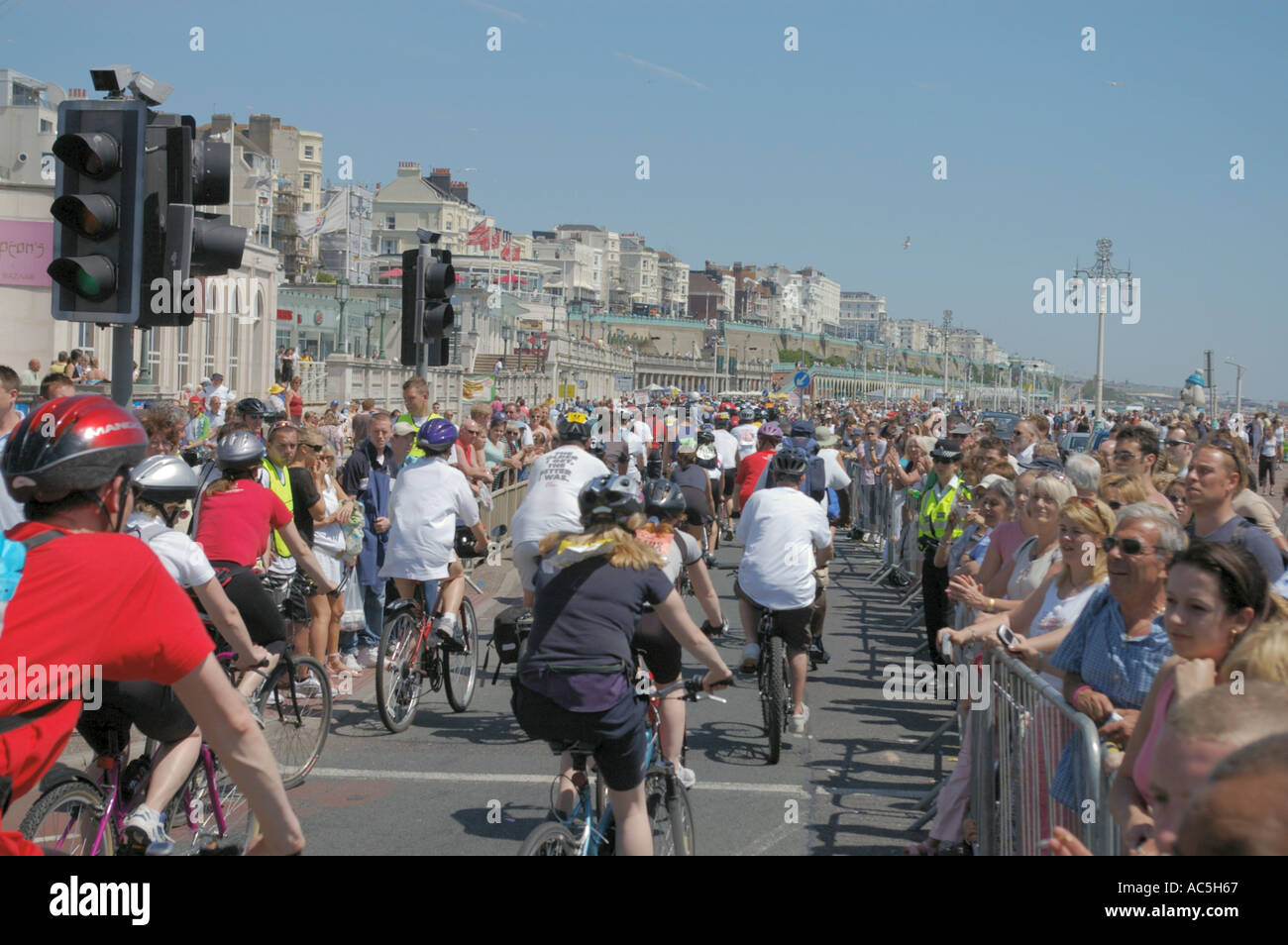 sponsored riders on Brighton promenade at finish of London to Brighton bike ride Stock Photo