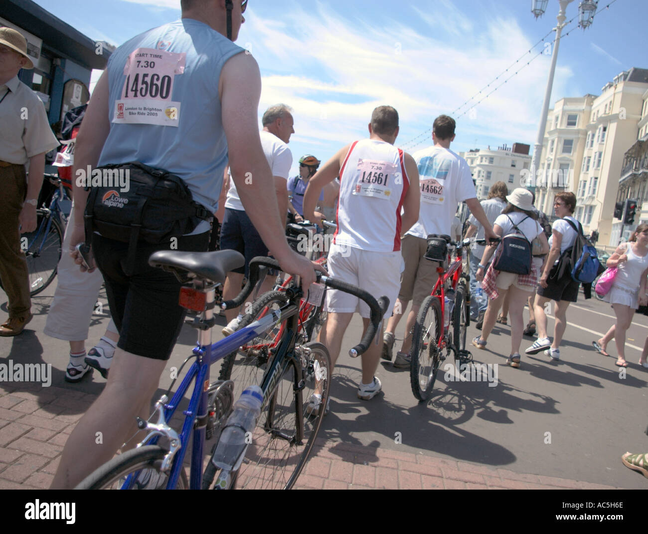 sponsored riders on Brighton promenade at finish of London to Brighton bike ride Stock Photo