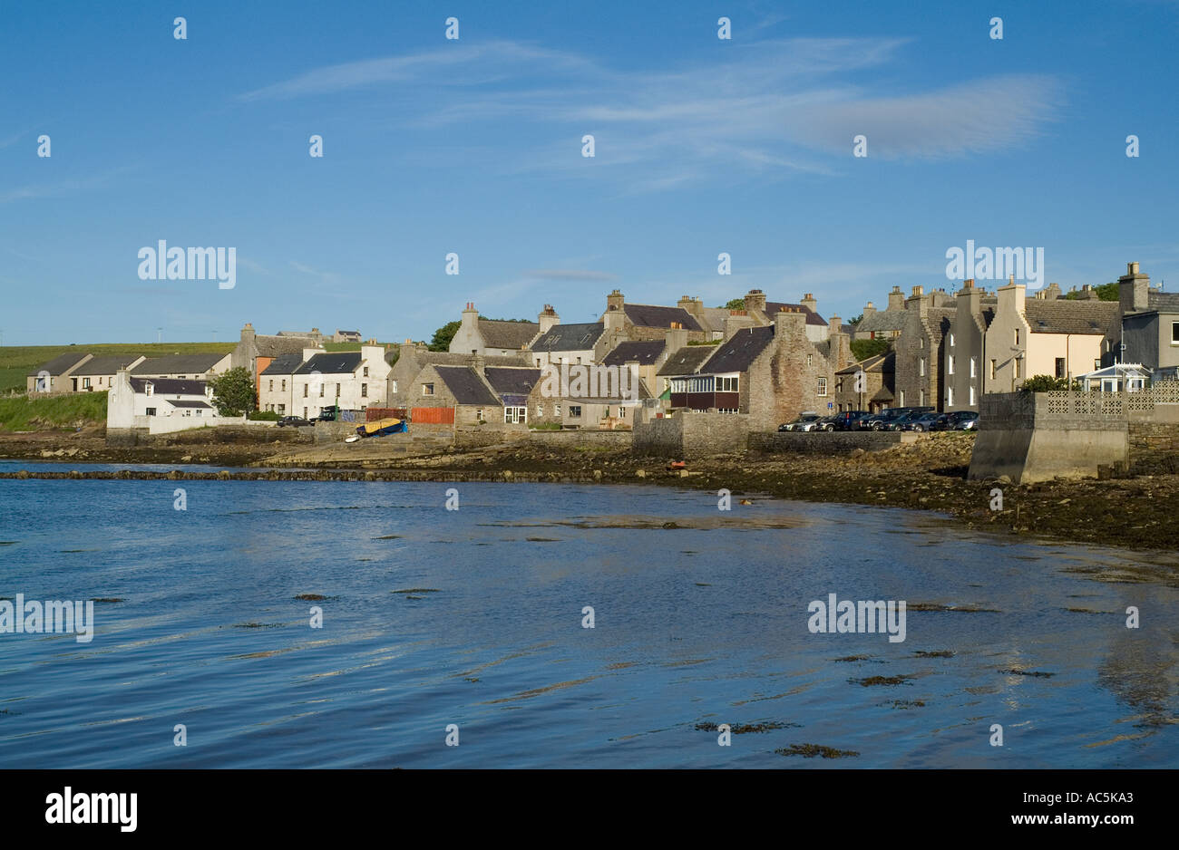dh St Margarets Hope SOUTH RONALDSAY ORKNEY Waterfront quayside harbour houses town scotland village sea islands seafront scottish island community Stock Photo