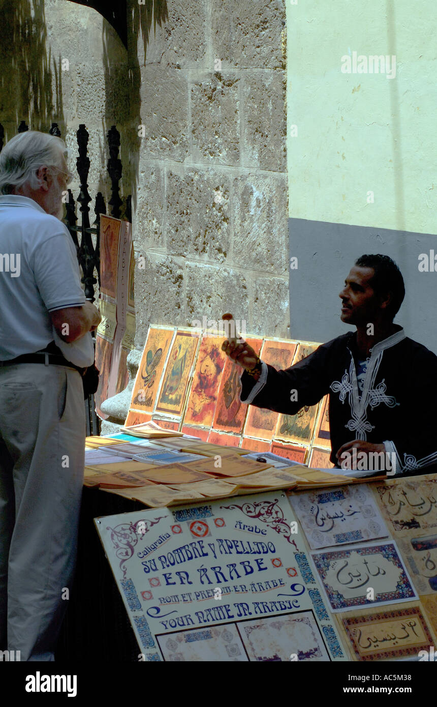 Tourist barter's and haggle's for souvenirs in the narrow streets