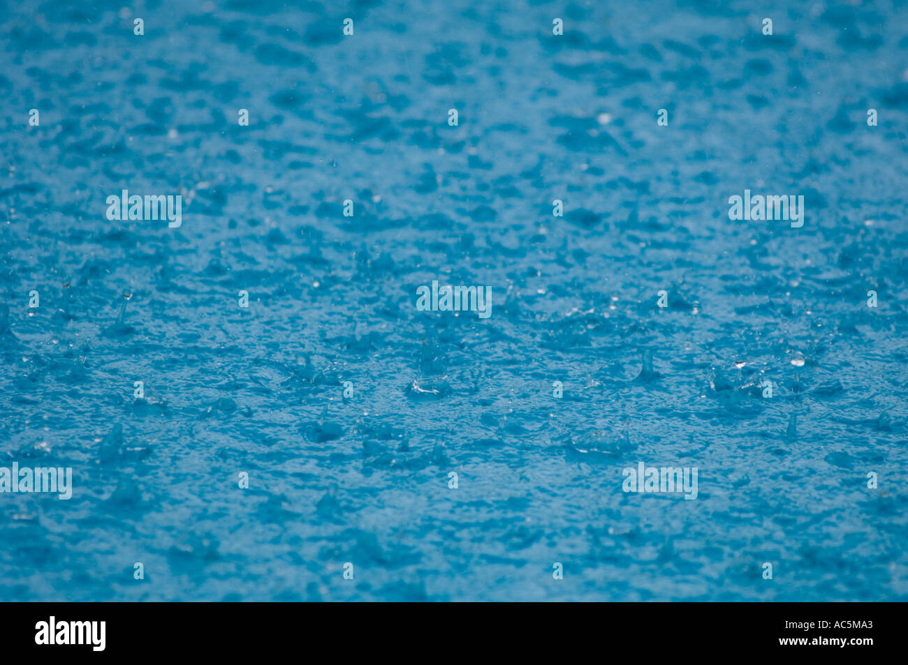 raindrops on pool Stock Photo
