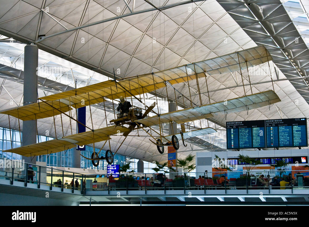 Display Replica of first Plane to fly in Hong Kong Spirt of Sha Tin Biplane inside HKG Hong Kong International Airport Stock Photo