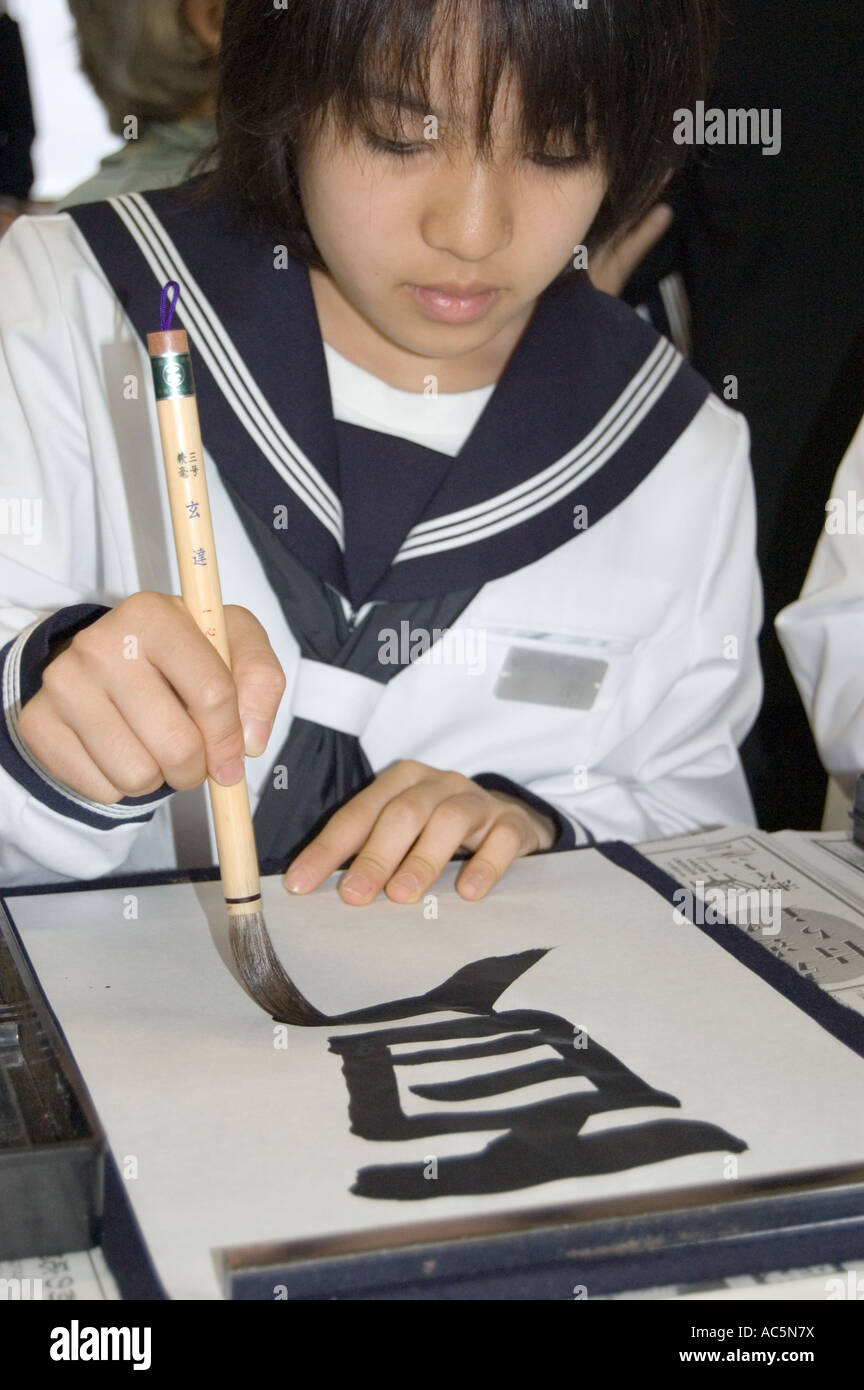 Japanese student practicing calligraphy Stock Photo