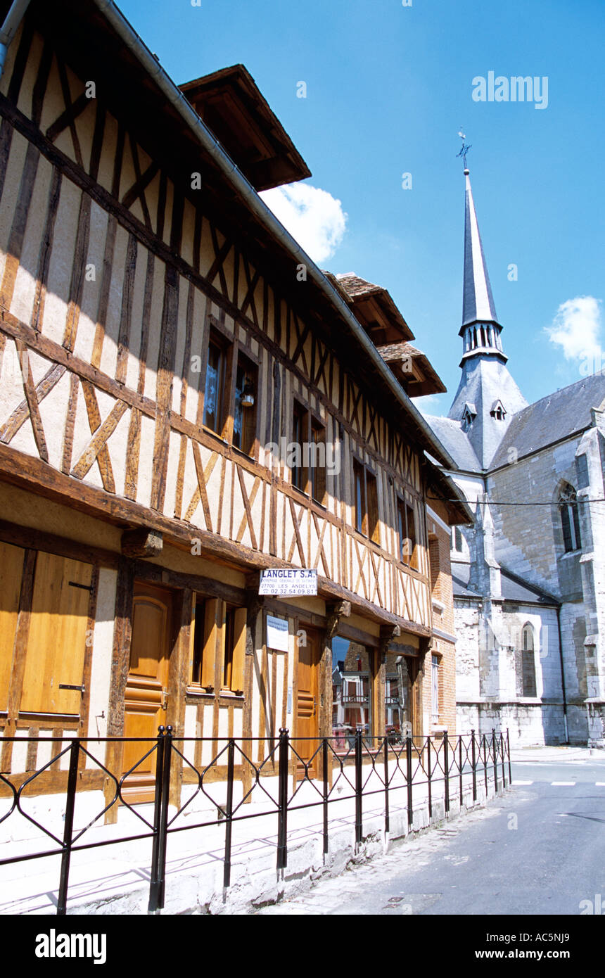 Old brown and white buildings and Saint Sauveur Church, Petit Andely