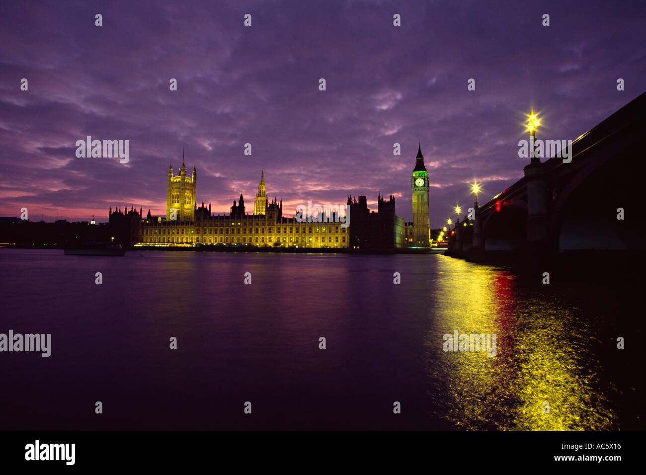 Westminster Bridge Big Ben Wesminster Abbey and their reflections in the River Thames at dusk in London England Castle Clear Sky Stock Photo