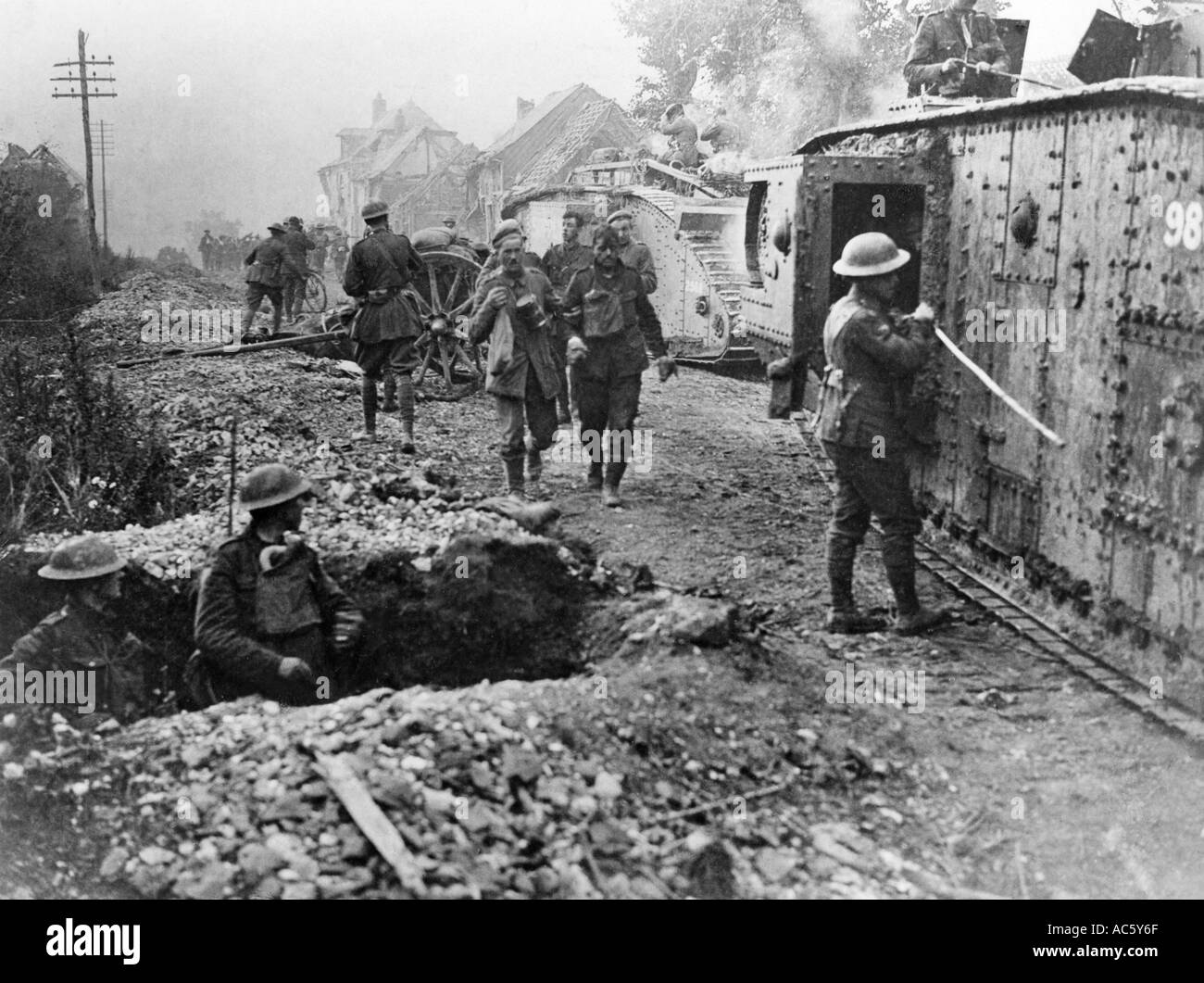 WWI Allied soldiers pass through village of Hourges France during Battle of Amiens August 1918 Stock Photo