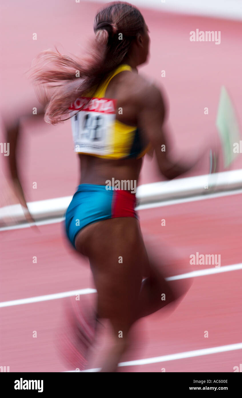 female competitor in a relay race Stock Photo Alamy