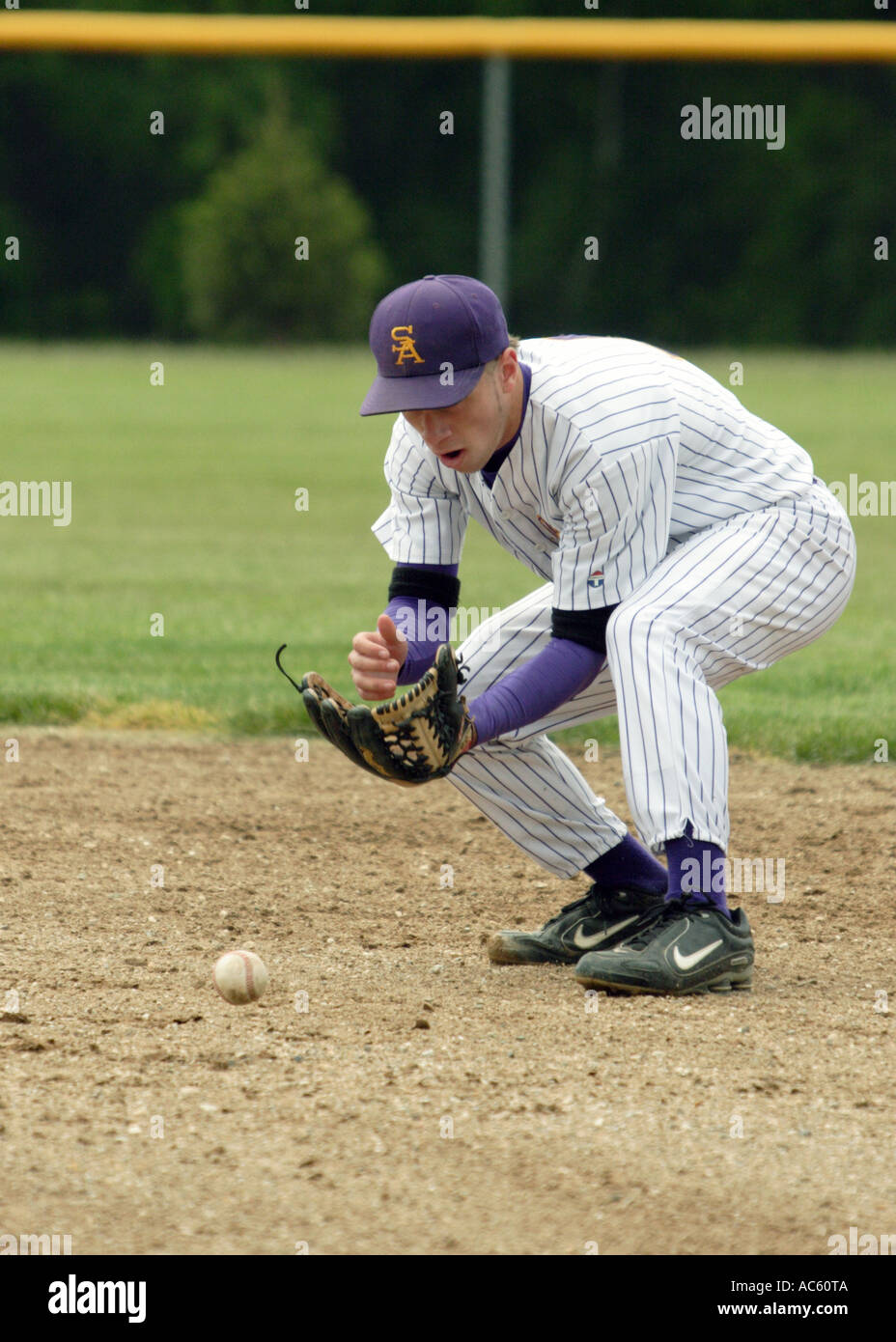 Second baseman scoops up a ground ball Stock Photo Alamy