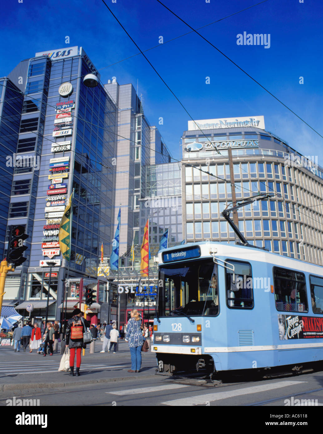 Electric tram with Oslo City shopping centre beyond, central Oslo, Norway. Stock Photo