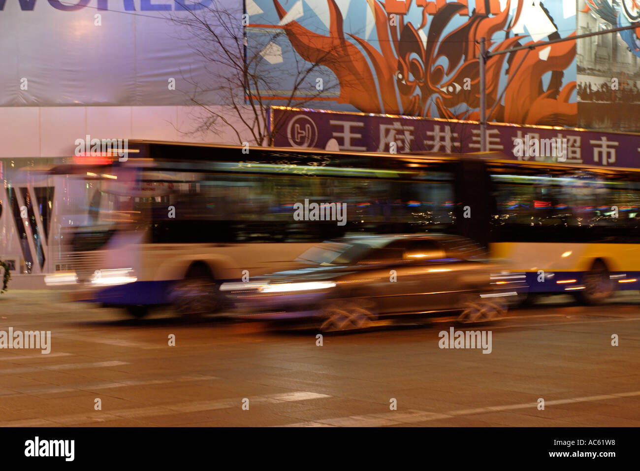 Buses and cars in Beijing, China at night Stock Photo