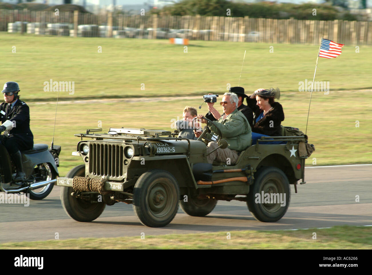 Vintage Jeep with Police Outrider at Goodwood Revival Meeting 2003 West Sussex England United Kingdom UK Stock Photo