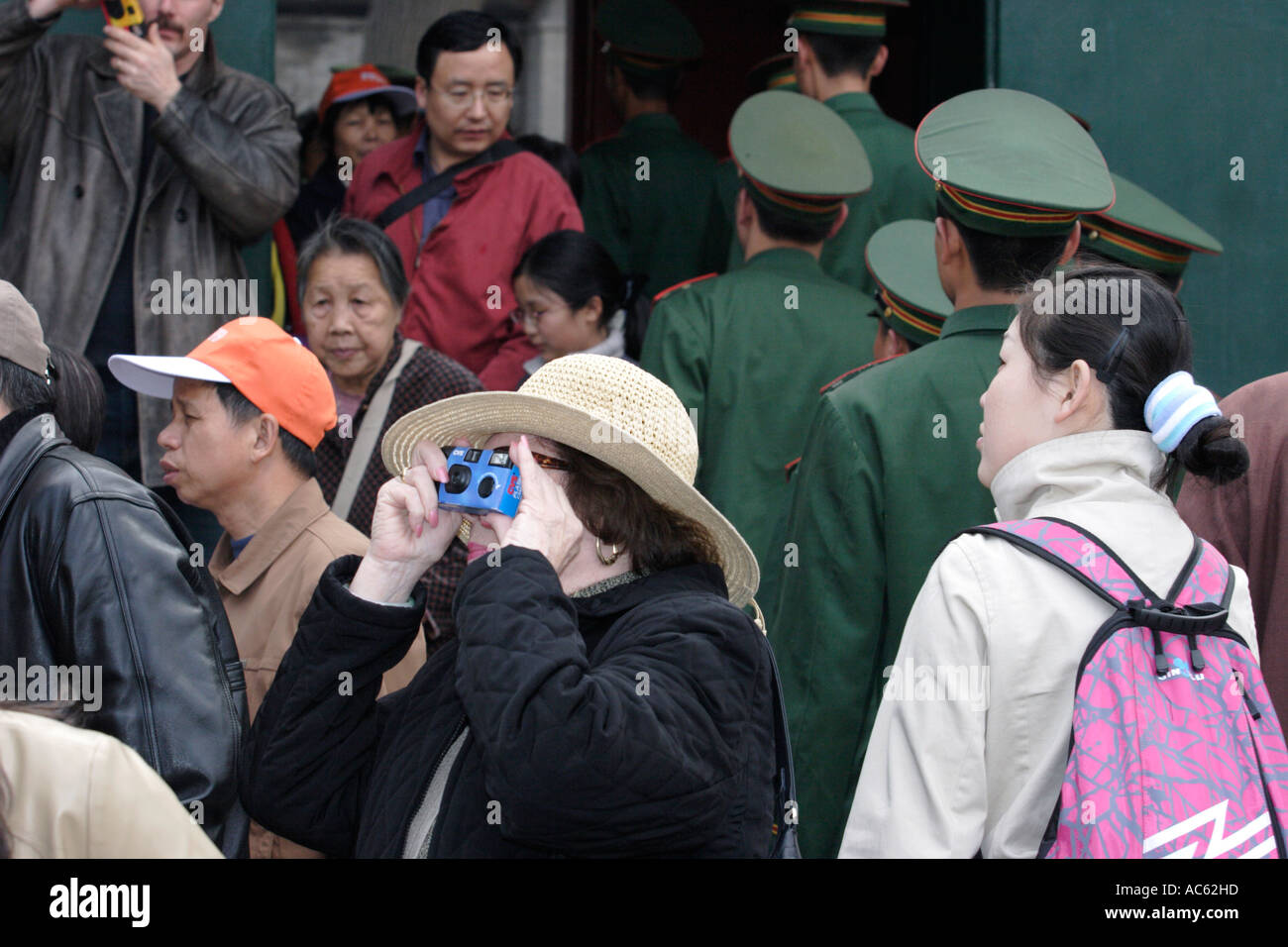 Woman snapping pictures in Forbidden City Stock Photo