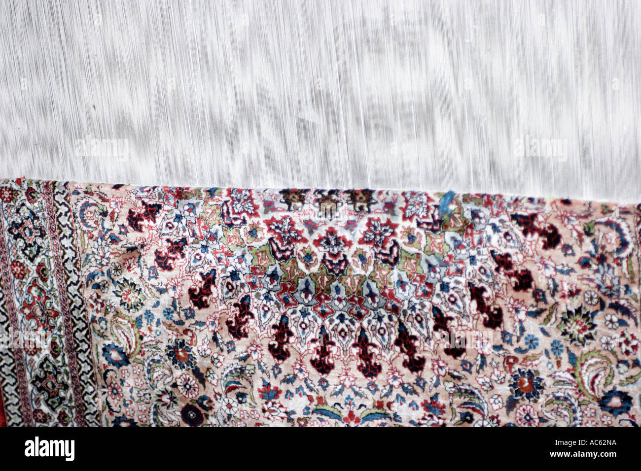 Closeup of Chinese Silk Rug in the process of being made Stock Photo