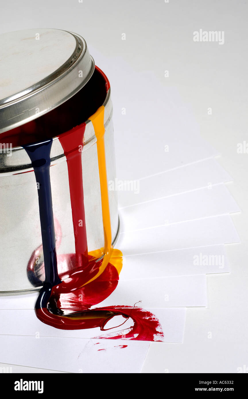 Red yellow blue printer s ink running down side of tin Stock Photo