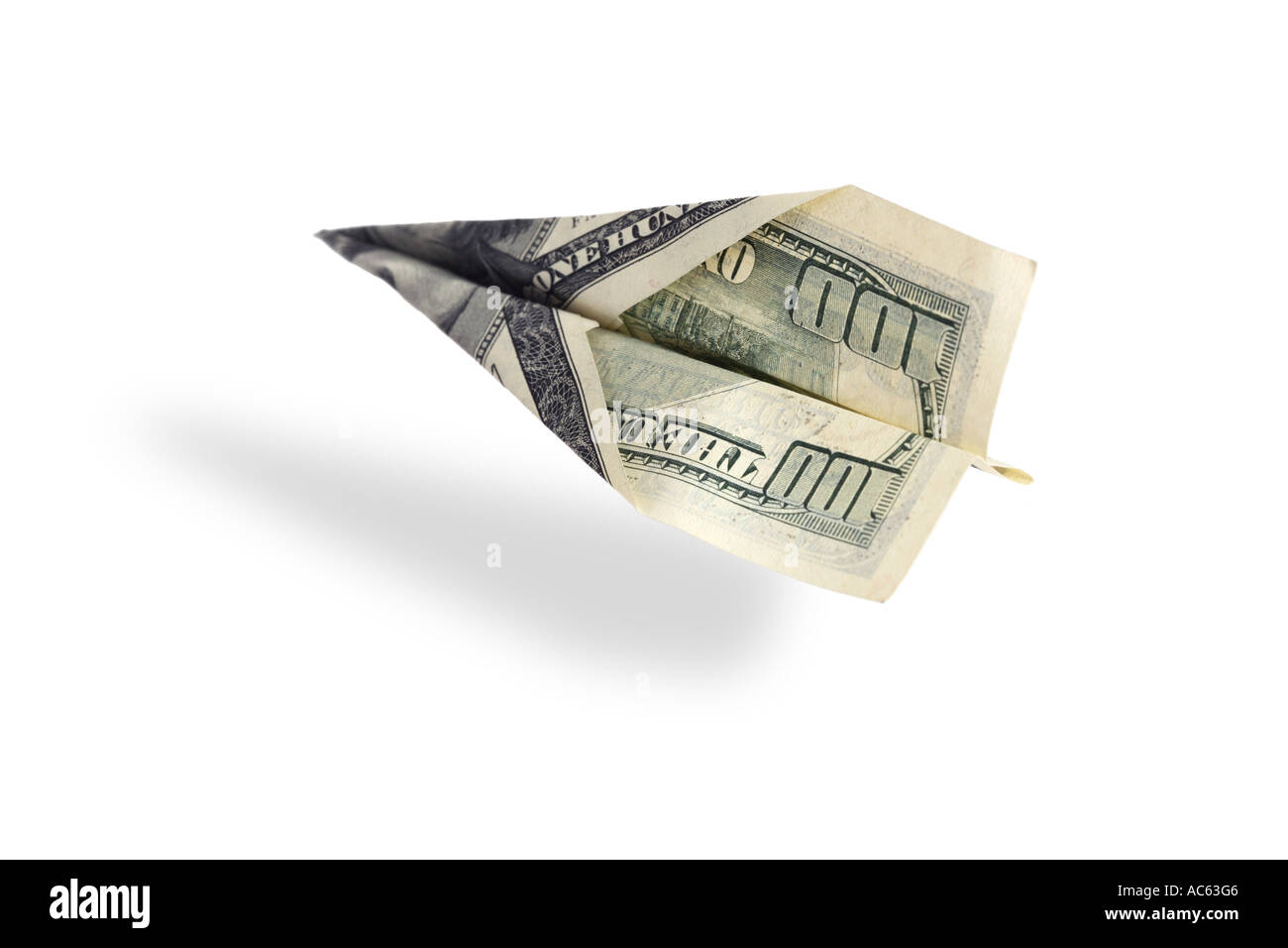 Paper airplane made from 100 dollar bill Stock Photo