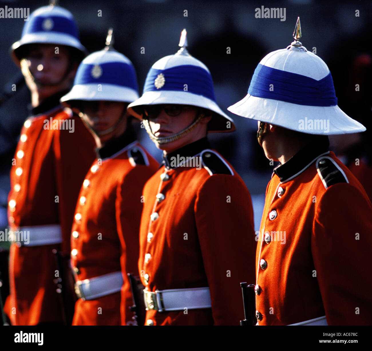 19th century English soldiers in parade dress with pith helmets Stock