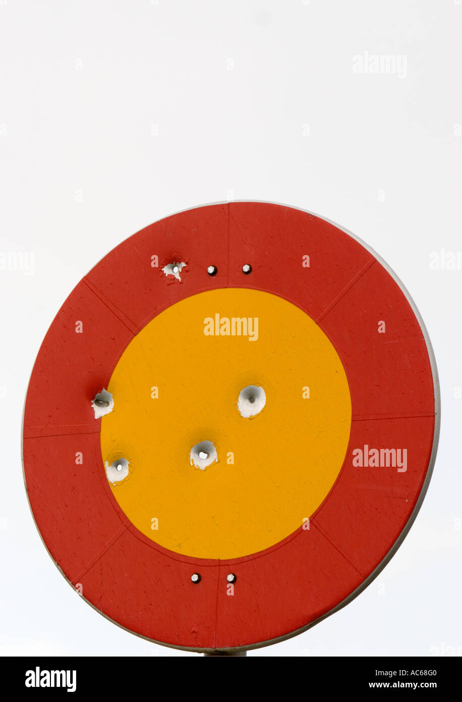 Bullet holes on round, red and yellow coloured metallic Finnish traffic sign  number 311. ( Closed to all vehicles ) , Finland Stock Photo