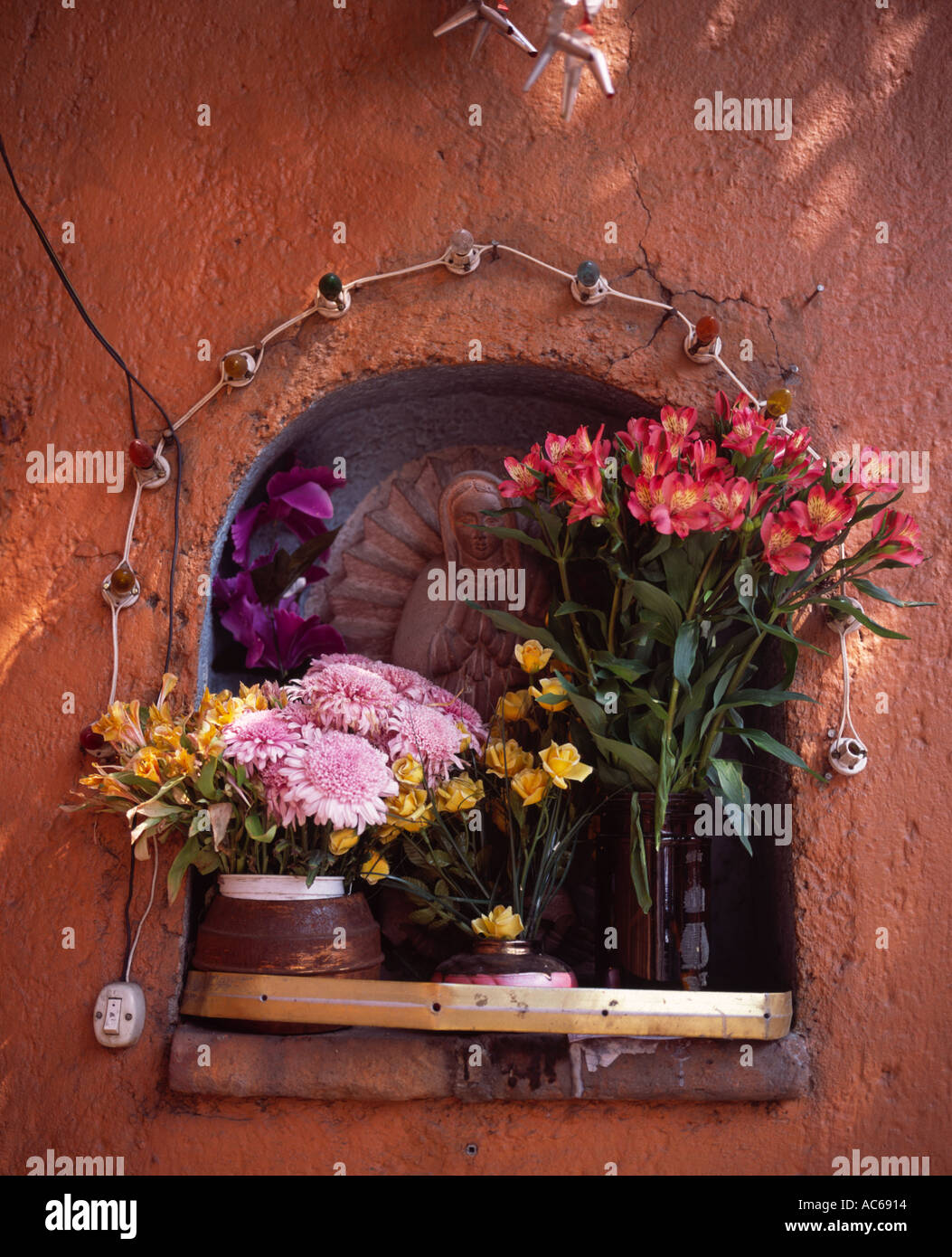 Altar In Wall Of A Cemetery With Vases Of Flowers Day Of The Dead