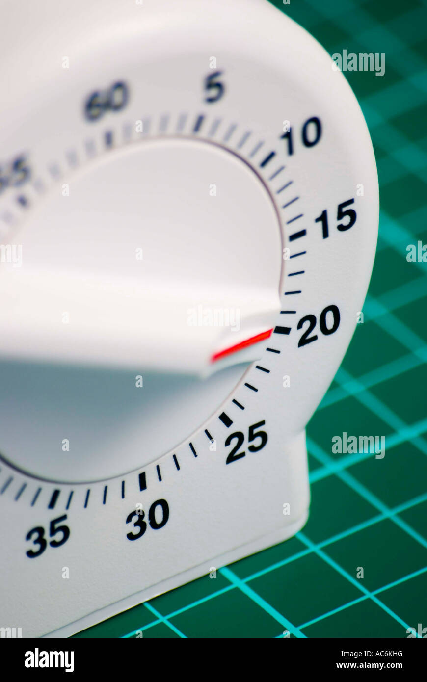 A clockwork kitchen timer set for a period of twenty minutes Stock