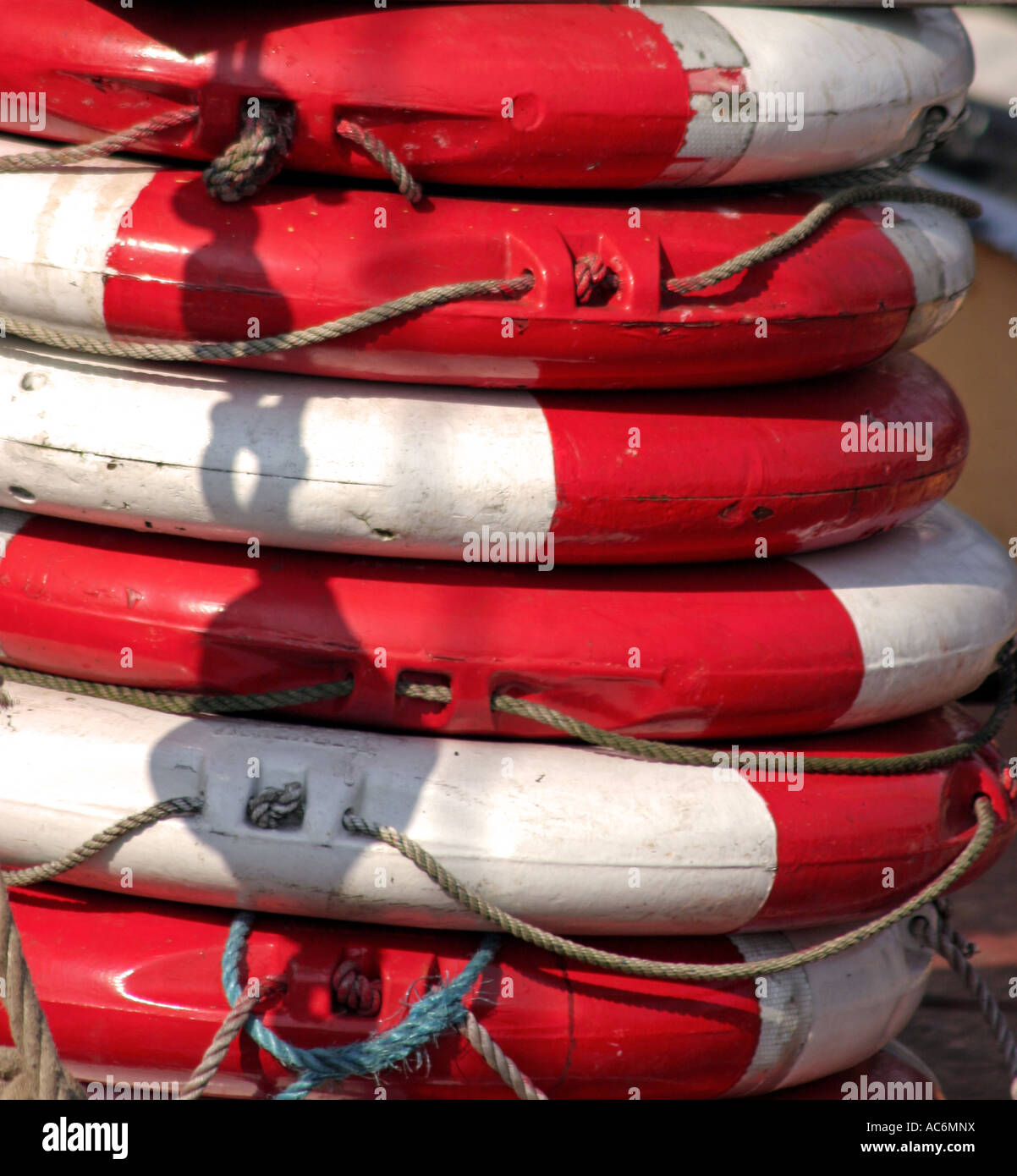 Pile of red and white lifebuoys Stock Photo