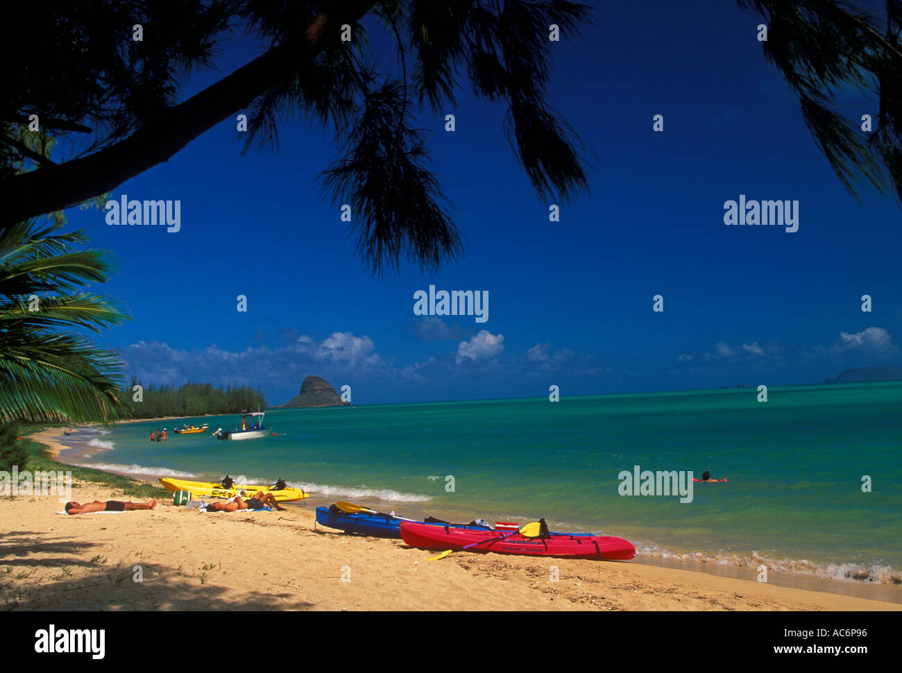 Beach along Kaneohe Bay with Mokolii Island Chinamans Hat in the background Oahu Island Hawaii United States Stock Photo
