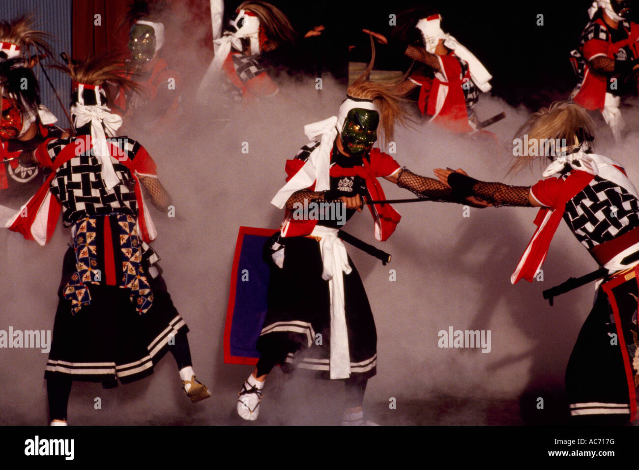 The Tsugaru Shamisen Players from Japan performing the Traditional Sword Dance of the Demons on Stage Stock Photo