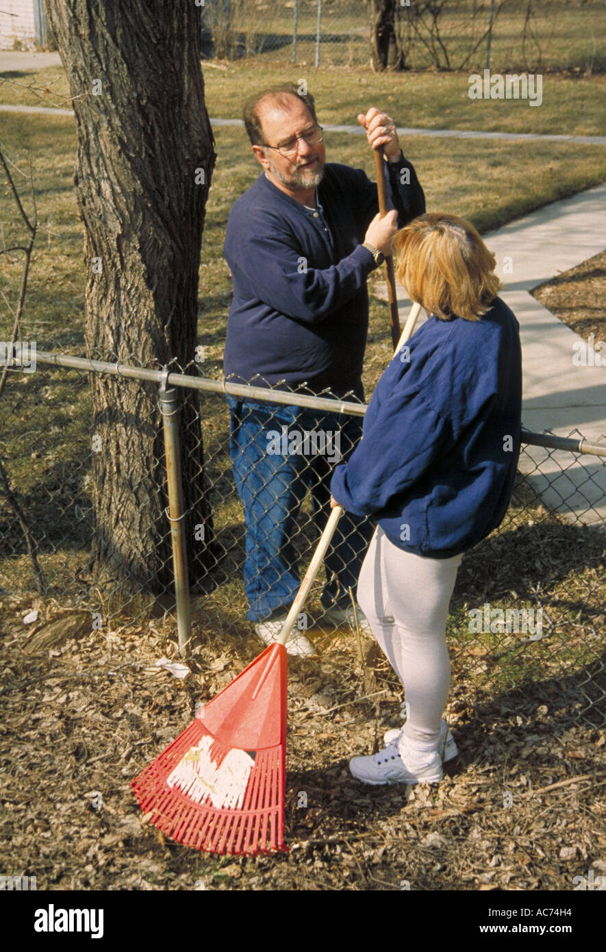 Neighbors talking fence hires stock photography and images Alamy