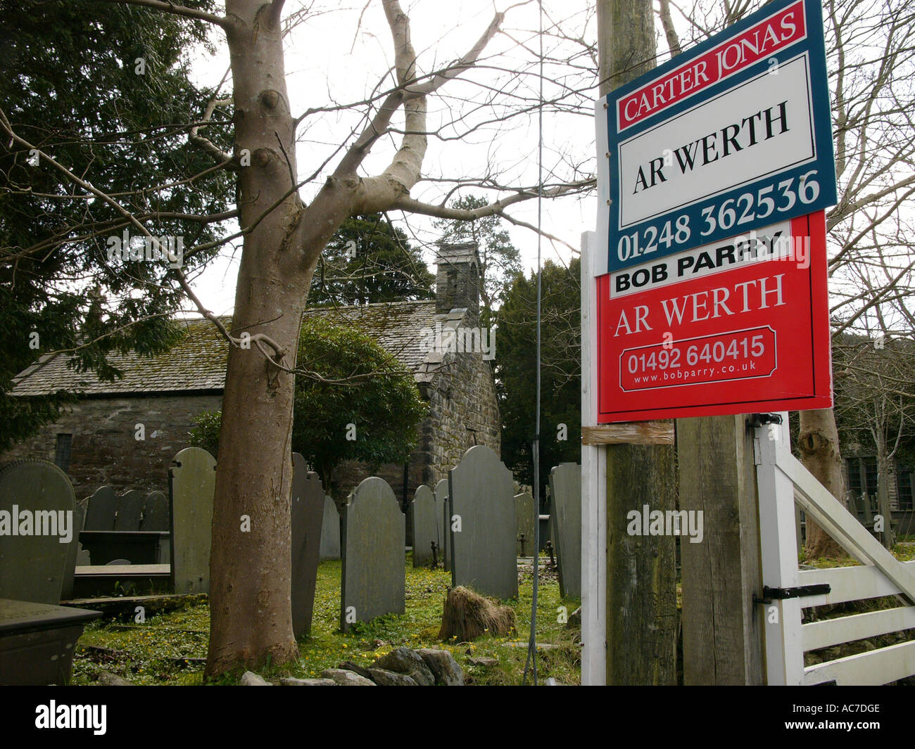 old redundant welsh church for sale, Dolwyddelan Gwynedd snowdonia North Wales - estate agent sign in welsh language - UK Stock Photo