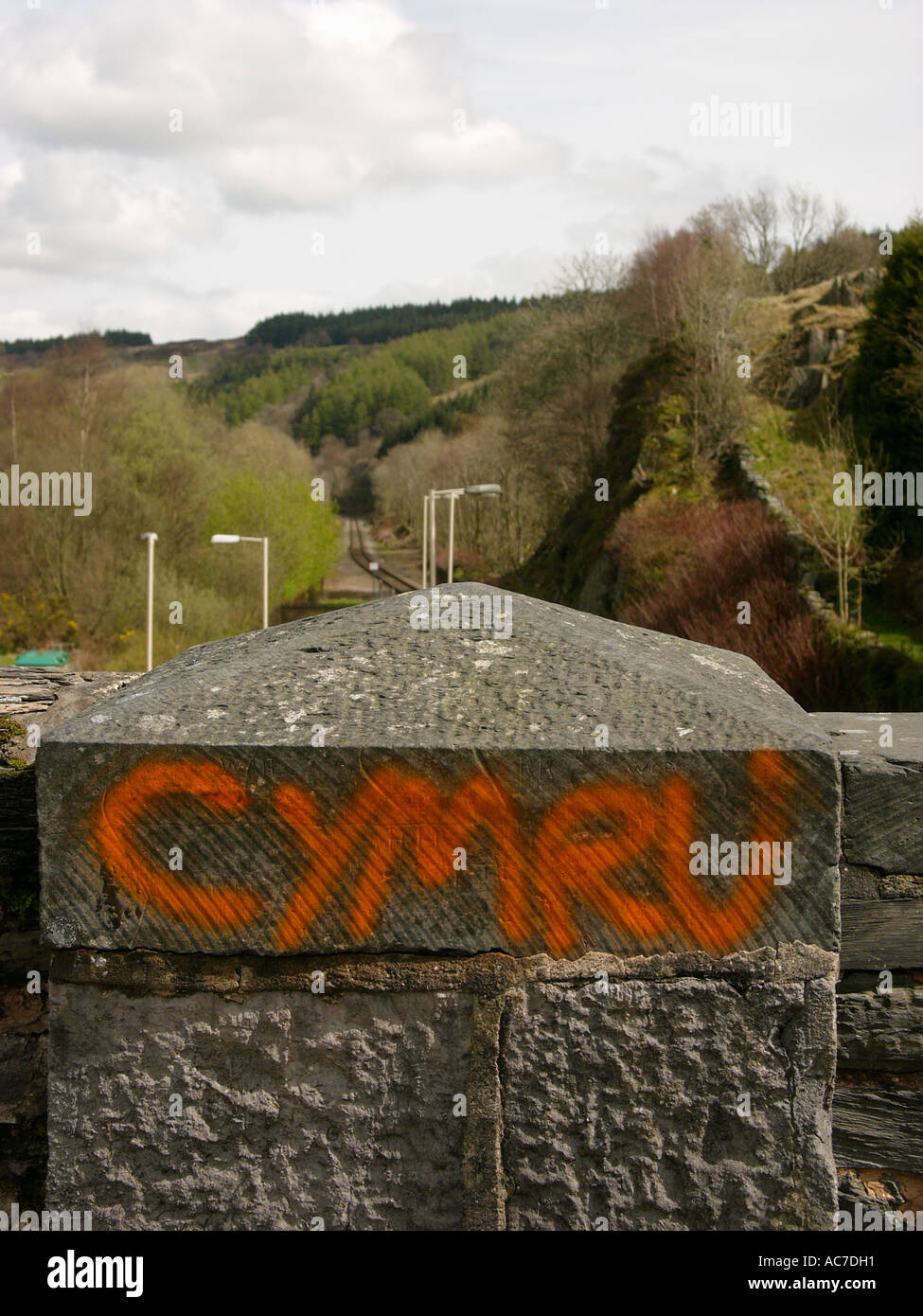 Cymru, the welsh word for Wales, graffiti  sprayed in red pint on a railway bridge in Dolwyddelan Gwynedd north wales UK Stock Photo