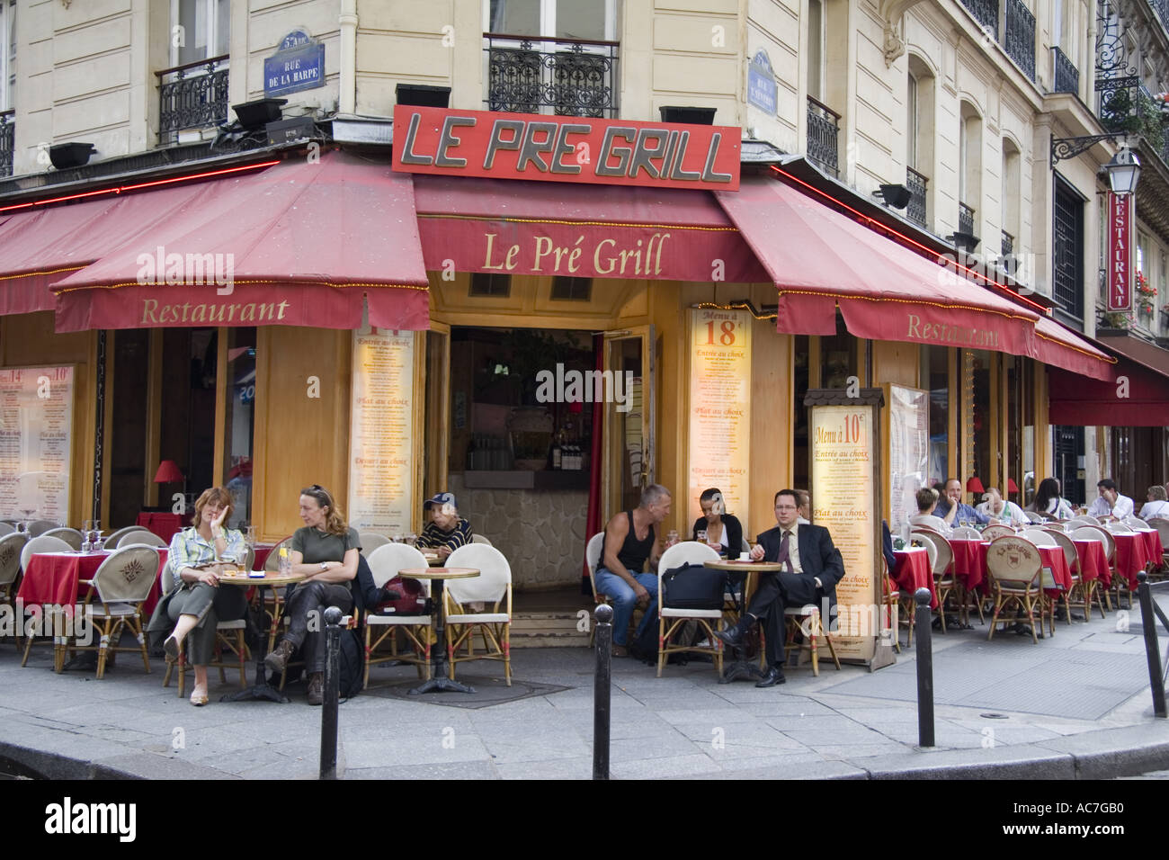 Latin Quarter restaurant Le Pre Grill on corner of Rue De La Harpe and Rue  Saint Severin Paris France Stock Photo - Alamy