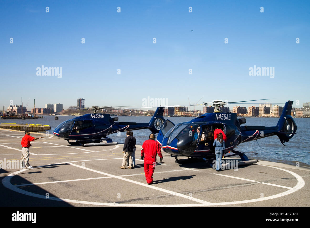New York City Manhattan and Hudson River Liberty helicopters on helipad in spring sun sunshine for scenic flights New York City Stock Photo