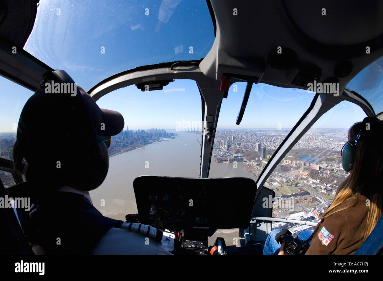 New York City Lower Manhattan downtown and Hudson River aerial photo from inside cockpit of helicopter New York City NY NYC Stock Photo