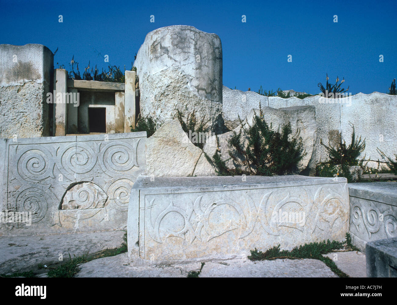 carved and decorated stone slabs and altar within the Tarxien Temple on the Mediterranean Island of Malta Stock Photo