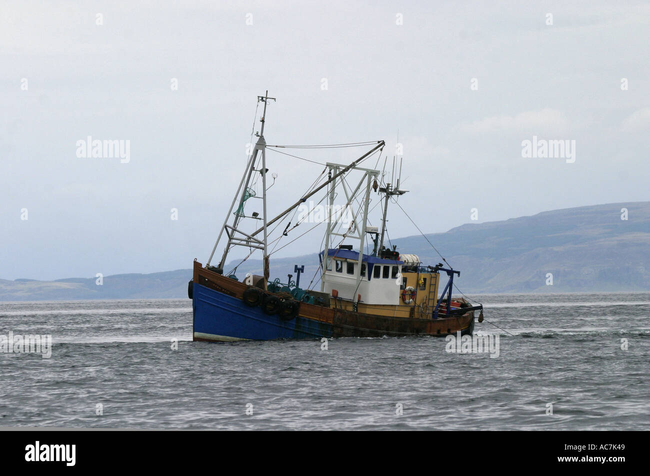 Scallop dredging boat operating in the Firth of Lorne SAC off Scotland s West coast Stock Photo