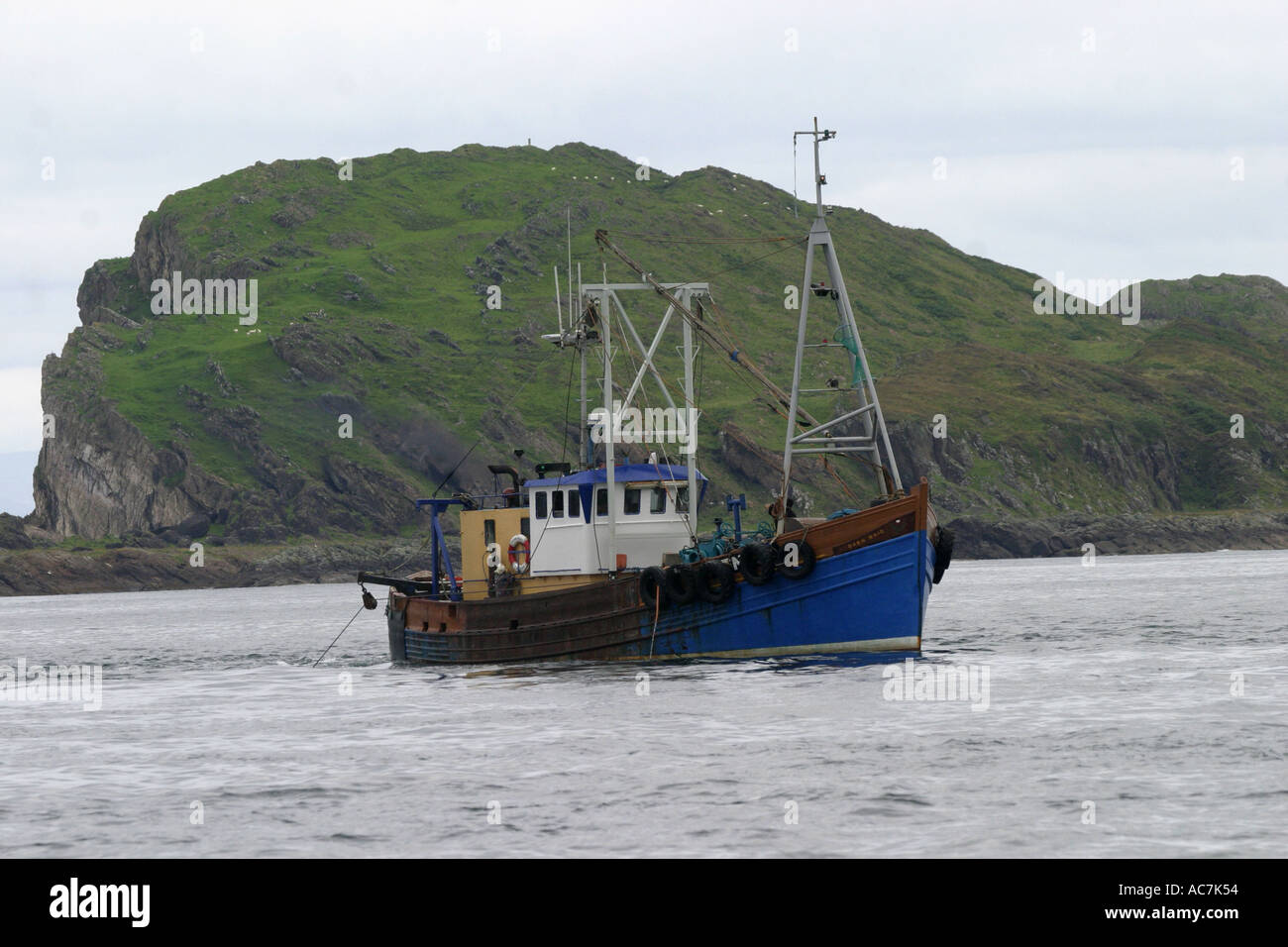 Scallop dredging boat operating in the Firth of Lorne SAC off Scotlands West coast Stock Photo