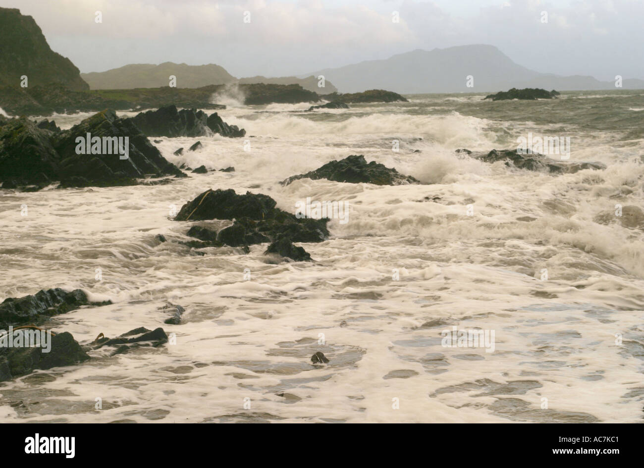 Hurricane waves crash into the rocky shore near Easdale,  Oban in January 2005 Stock Photo