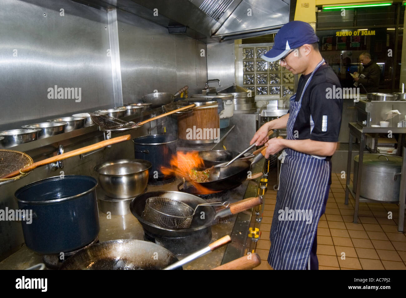 David Fung cooks in his takeaway Sheffield UK Stock Photo