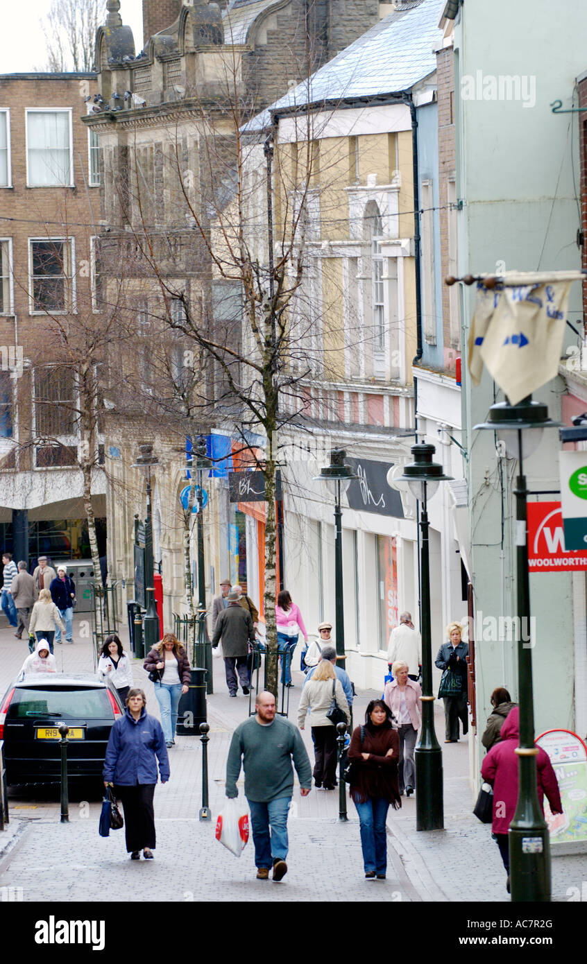 Shopping street with people walking in Carmarthen town centre