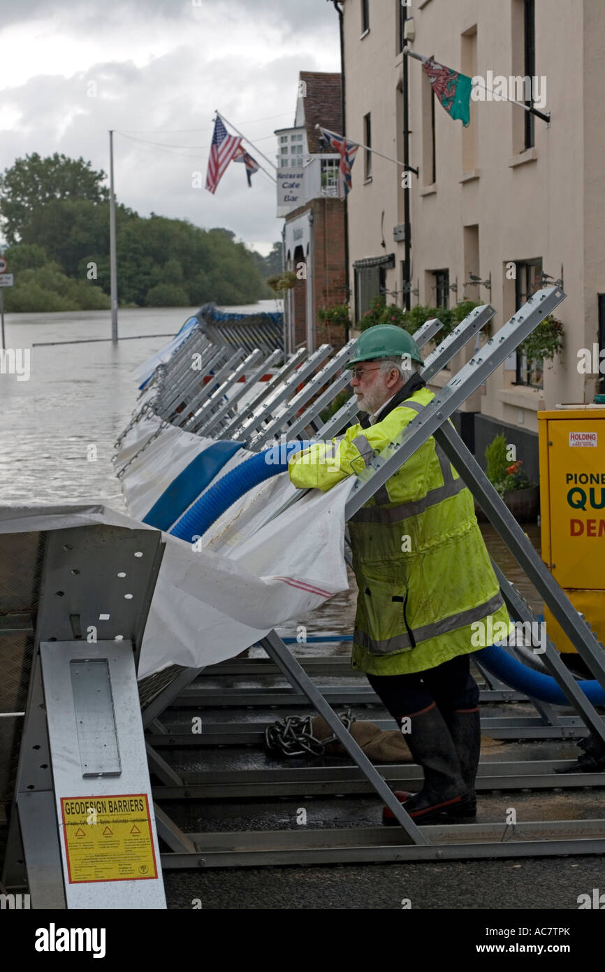 Environment Agency officials alongside flood barriers alongside River Severn June 27 2007 Upton upon Severn Worcs UK Stock Photo