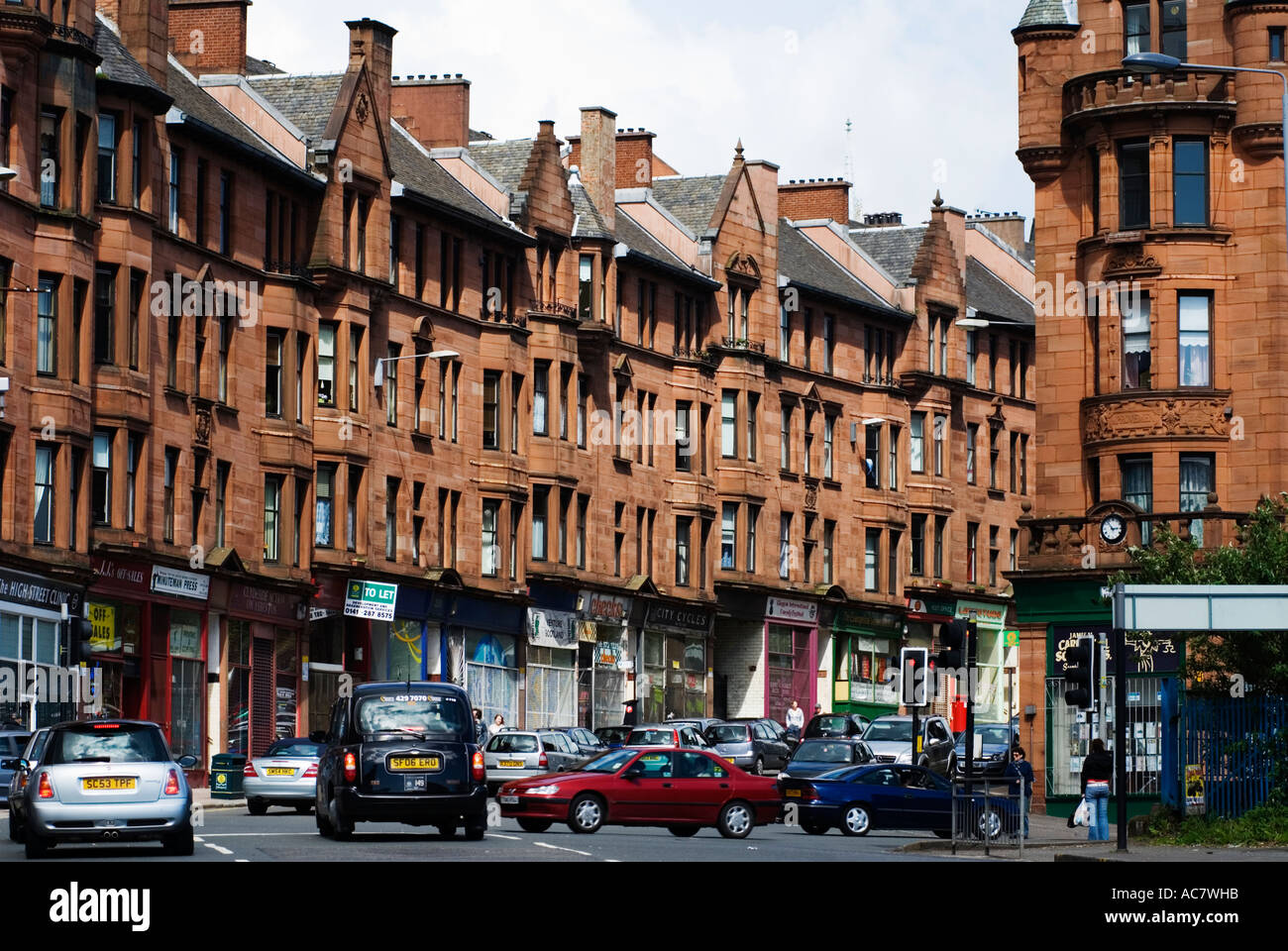 Typical old red sandstone built tenement housing in historic High Street in East End of Glasgow Scotland Stock Photo