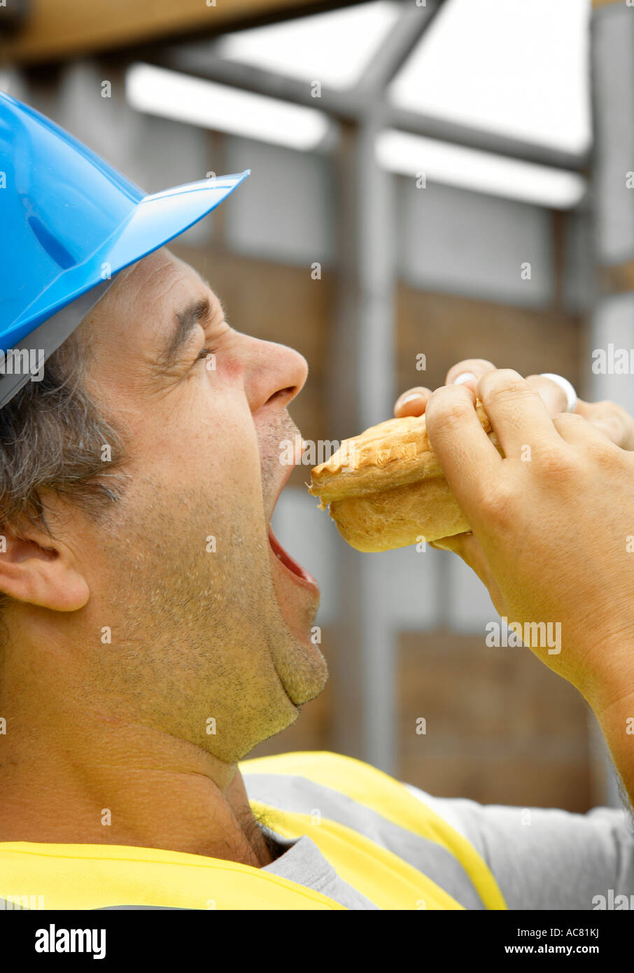 builder-eating-pie-for-lunch-stock-photo-alamy